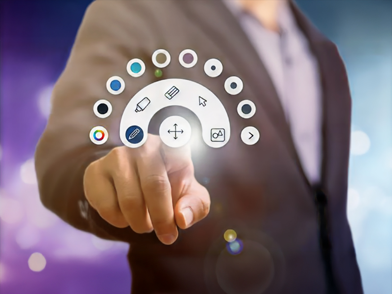 Business professional selecting digital interface icons representing Optoma's innovative technology solutions