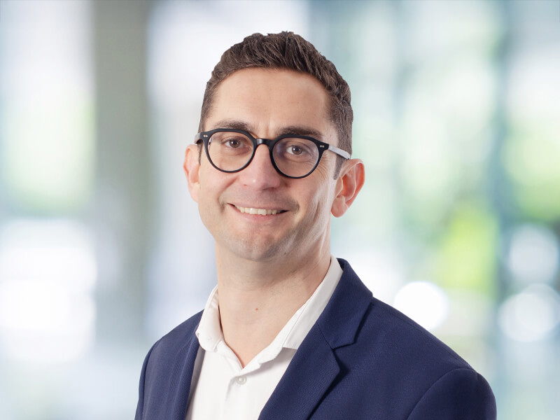Headshop of a business man wearing glasses. 
