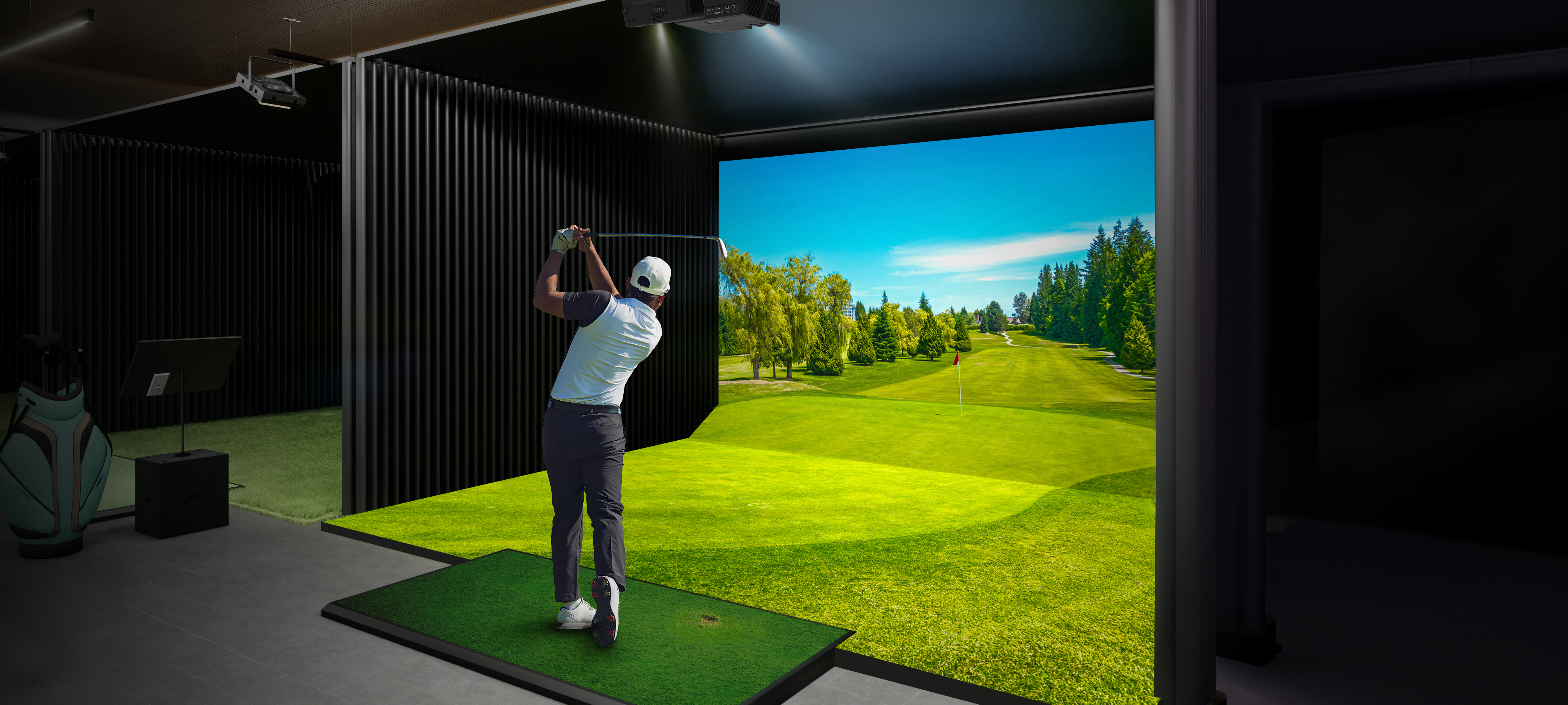 Male swinging golf club in golf simulation setting