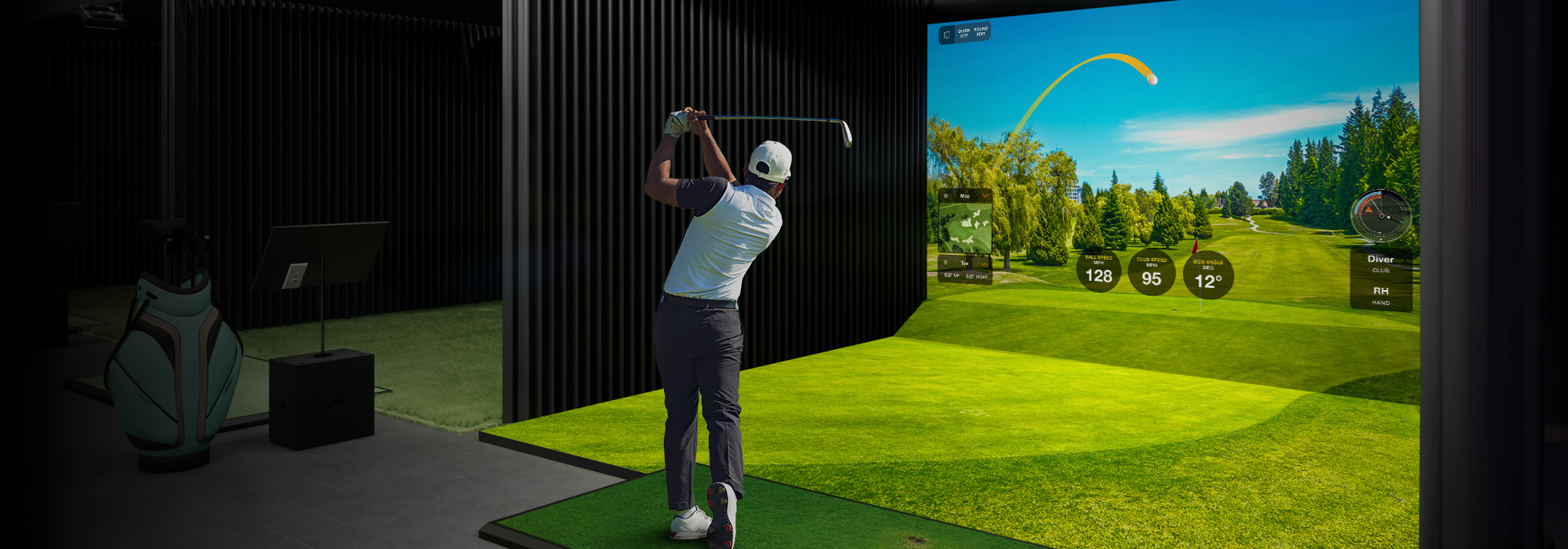 A golf simulator room with a realism look and feel to golfing. A man is taking a swing. 