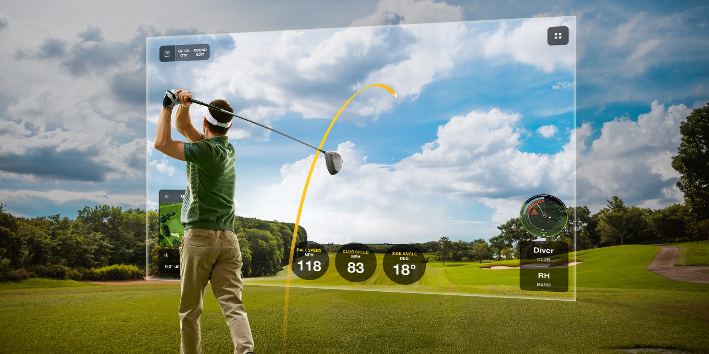 Male swinging golf club in golf simulation bay