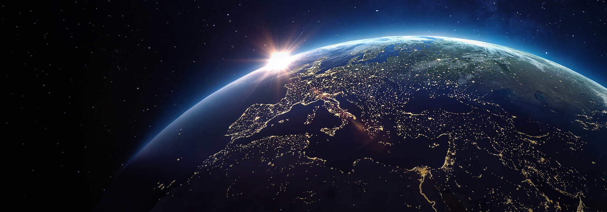 View of Earth from space showing sunrise over Europe and the Middle East, highlighting global connectivity, innovation, and international presence