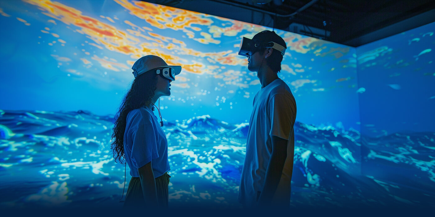 Two people wearing virtual reality (VR) headsets experience an immersive digital ocean environment, surrounded by vibrant blue waves and a glowing sky projection. This futuristic VR setup showcases cutting-edge augmented reality (AR) and immersive technology for interactive exhibitions or digital art installations.