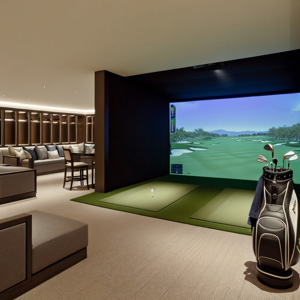 Premium home golf simulator with artificial putting green and seating area