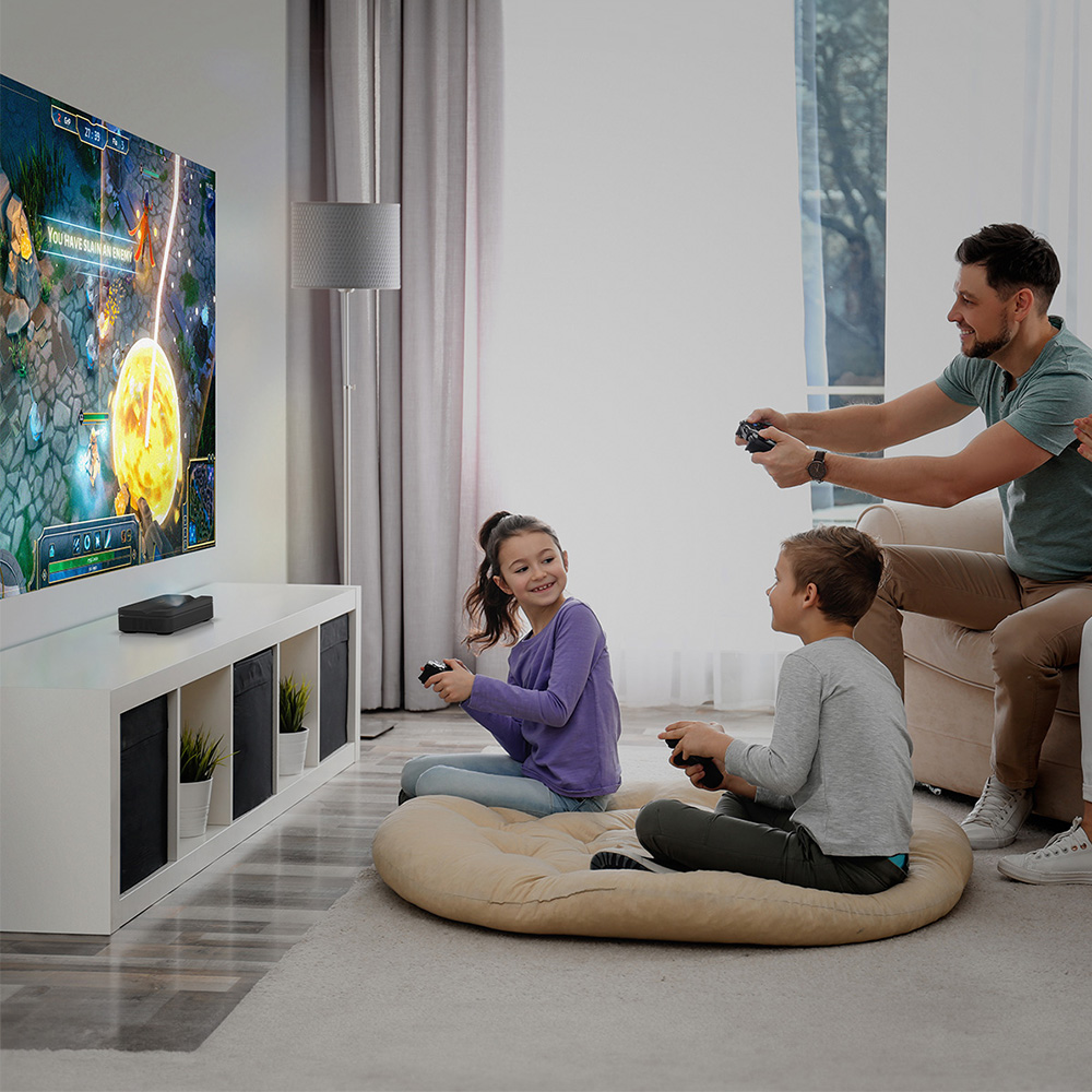 kid on beanbag father, son, daughter. UST projector
