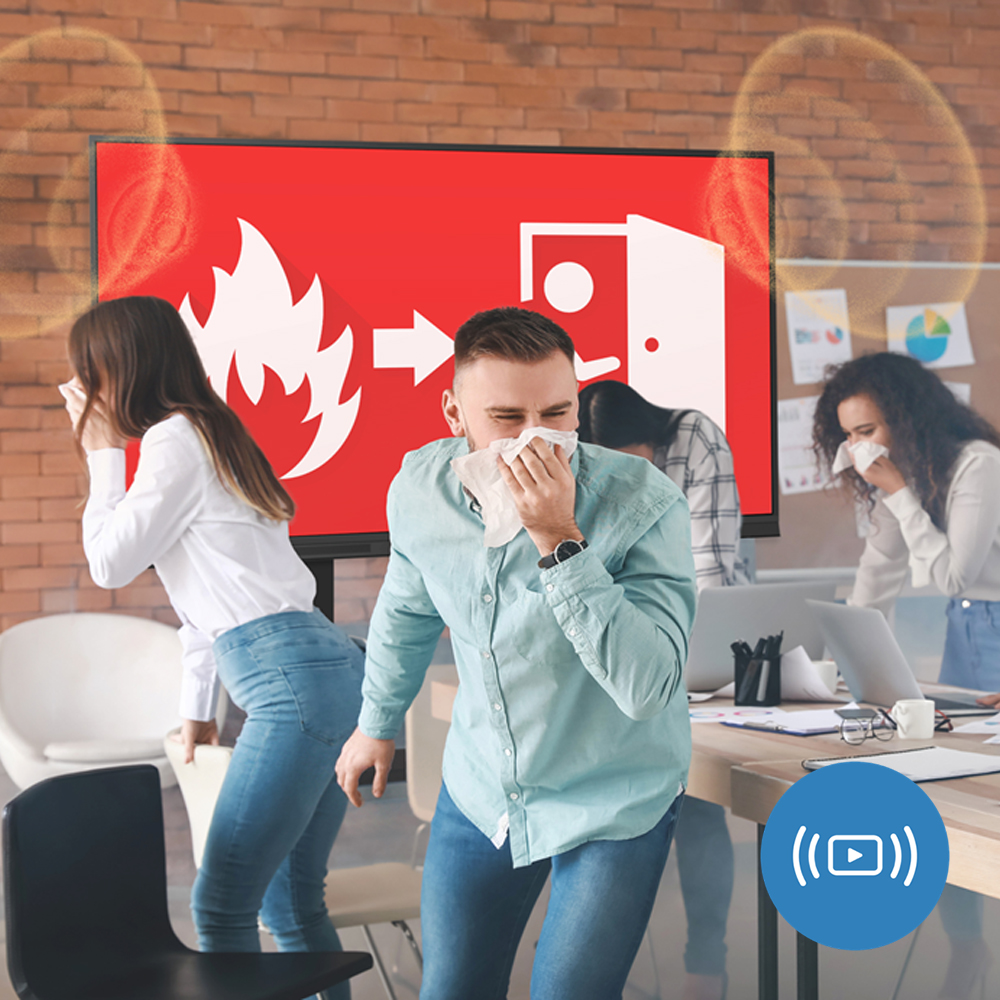 Emergency evacuation triggered by OMSC fire alert broadcast on Optoma LED display