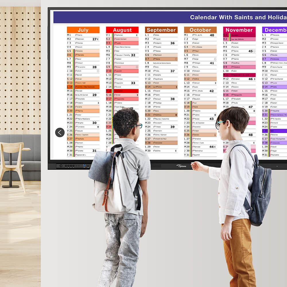 Students viewing digital menu board and events calendar in school cafeteria