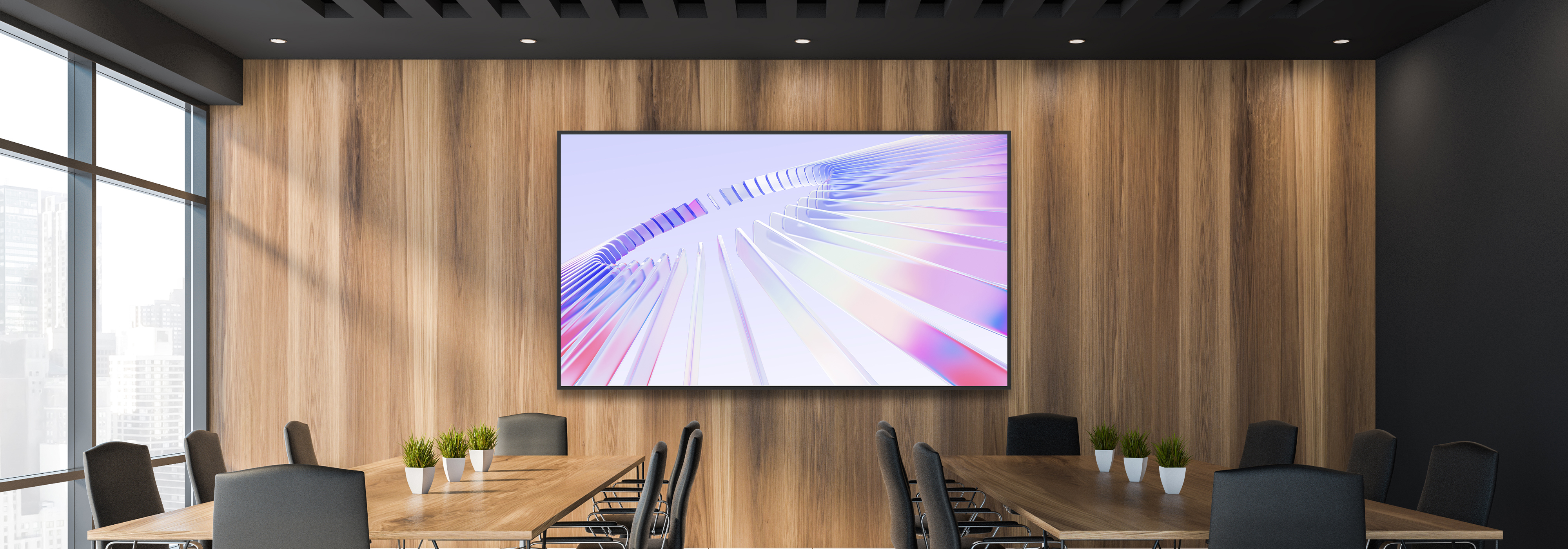 Conference room with Optoma N3862K flat panel display mounted on a wooden wall above meeting tables