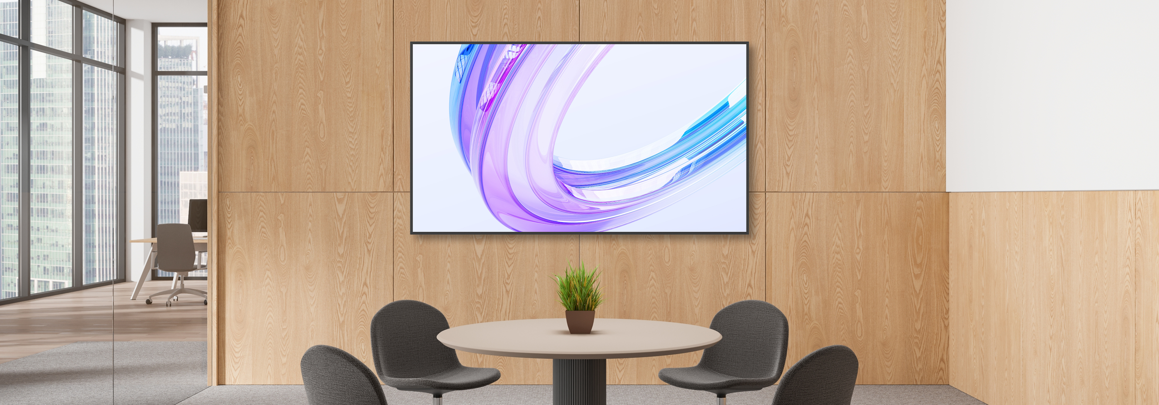 Conference room with Optoma N3432K flat panel display mounted on a wooden wall above meeting tables