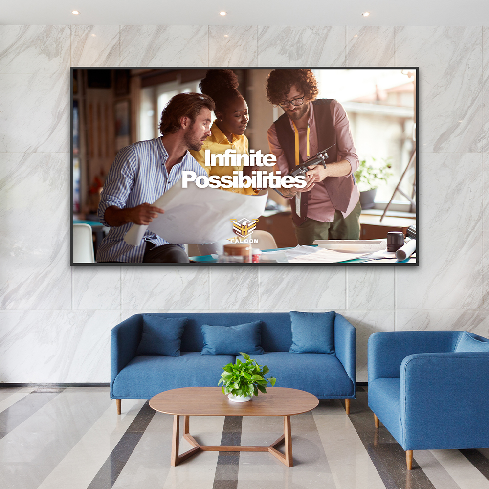 Optoma N3432K flat panel display mounted on a wall in a modern office lounge showing digital signage content